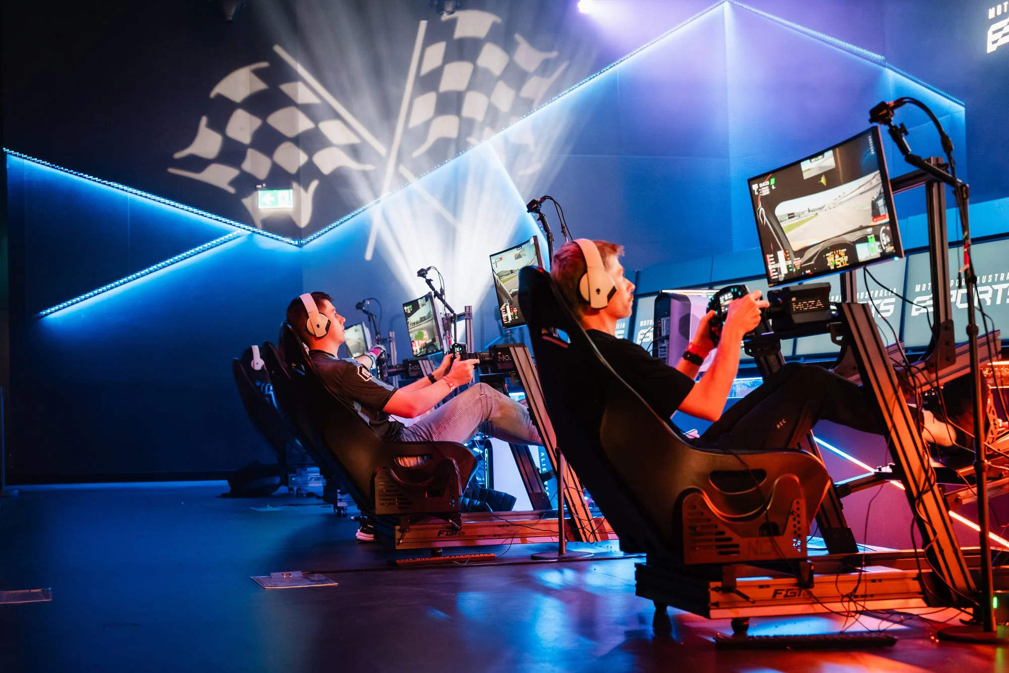 A bank of Sim Racing Garage rigs mid-race