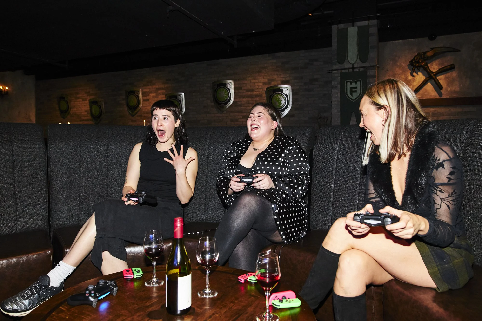 Guests picking up controllers in the Rekt Room lounge