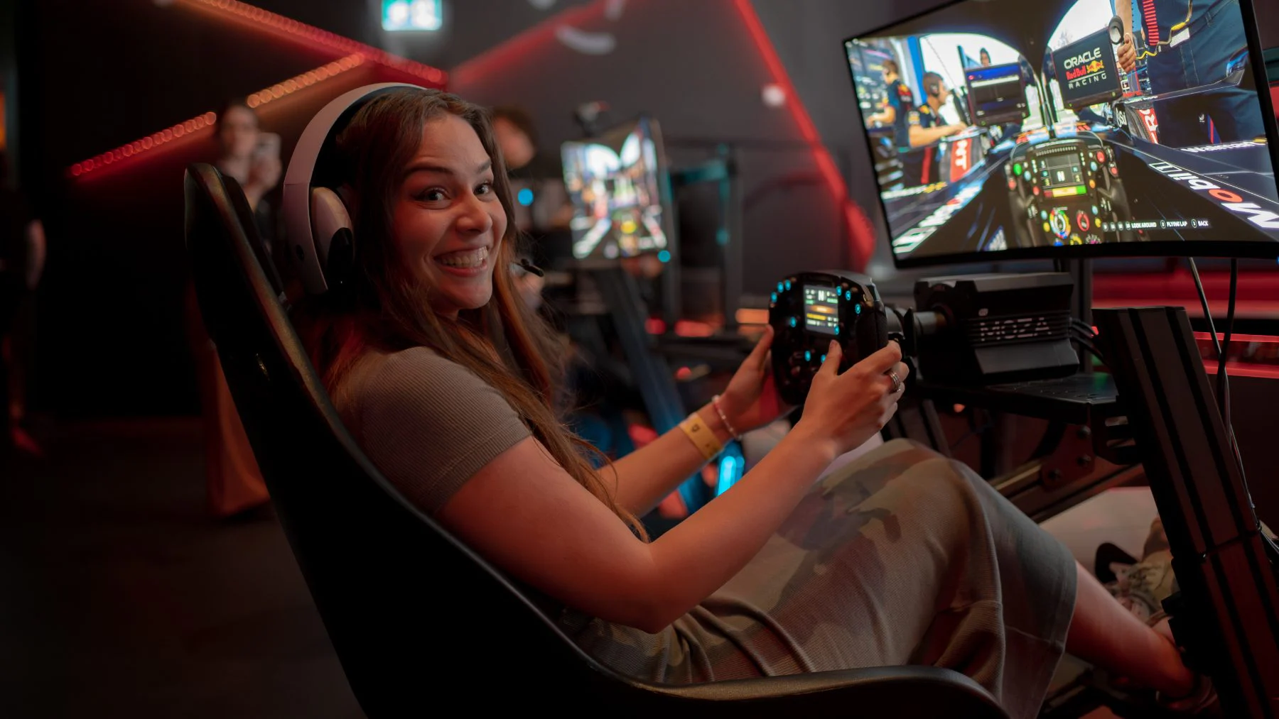 A guest driving a Sim Racing Garage rig at Fortress