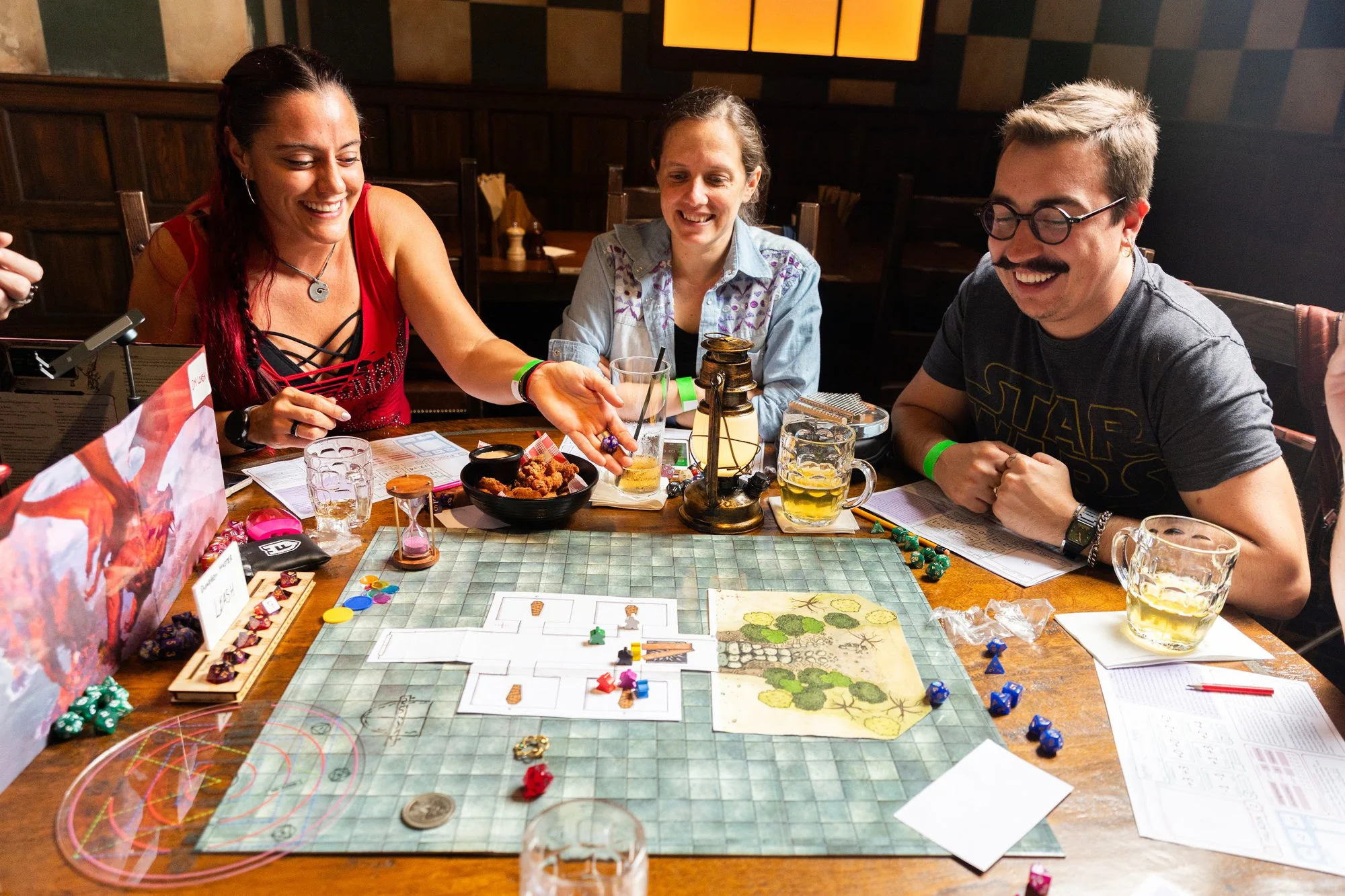 People gathered around a Tabletop Tavern game